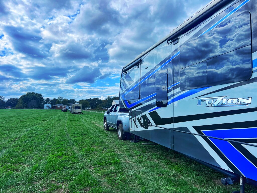 Finduscamping using one of the RV memberships called Harvest Host, parking in a nice level field