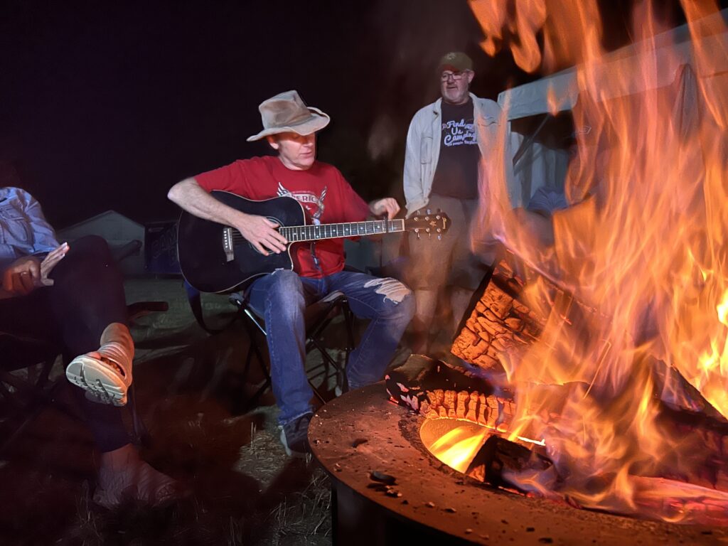 moochdocking Off the Grid RV Camping with some live music around a campfire