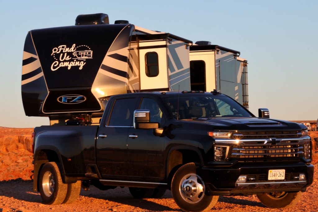 Diesel truck and 5th wheel with Find Us Camping logo