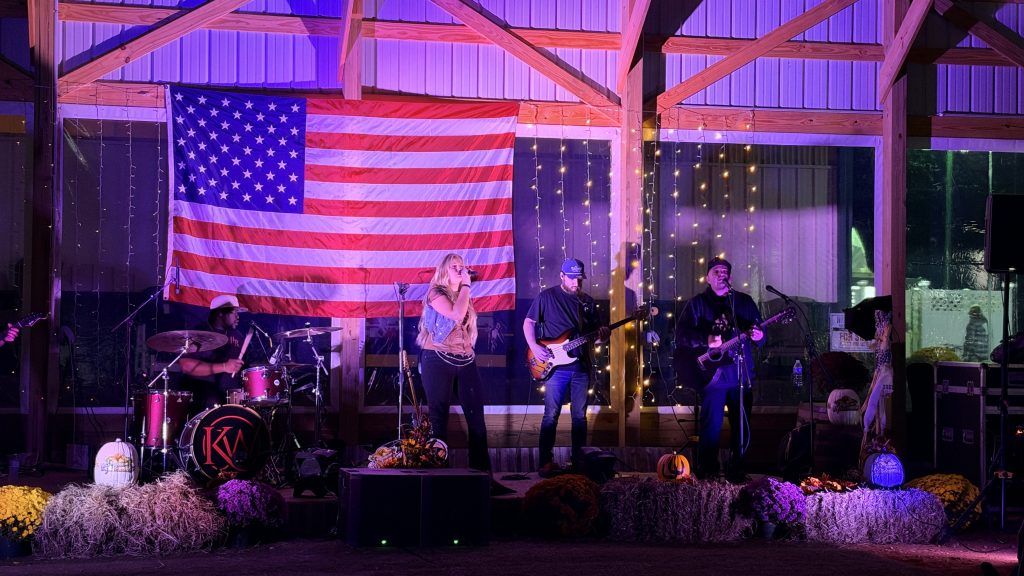 Kate Watson and the band on stage at the 2026 Barn Party