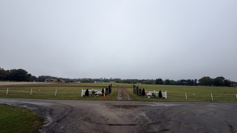 Wide open fields at Suttler Post Clydesdale Farm on a gray October morning