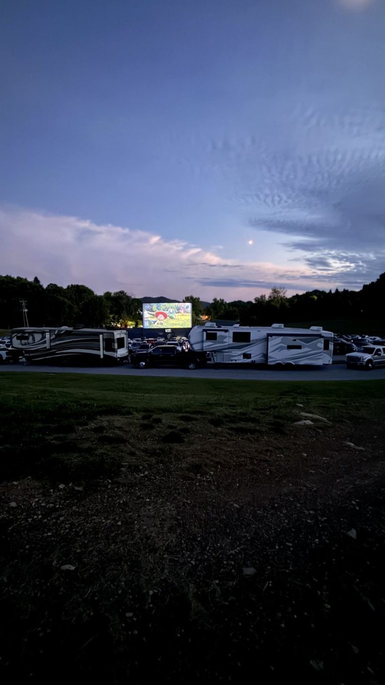 Drive-in movie playing behind the Village rigs