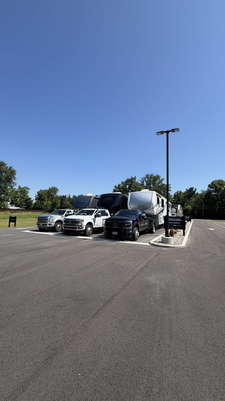 Village trucks and fifth wheels lined up at North Trace RV Resort
