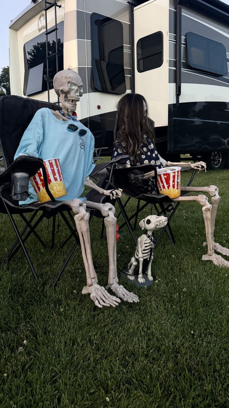 Skeletons with popcorn at the drive-in movie night